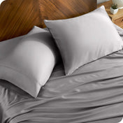 TENCEL™ pillowcases on pillows near a wooden headboard