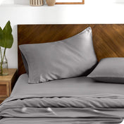 TENCEL™ pillowcases on pillows. One pillow is leaning against the headboard while the other is flat on the mattress.