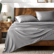 TENCEL™ sheet set on a bed. The flat sheet is draped over the side and end of the bed.