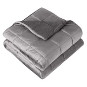 A minky weighted blanket folded neatly on a white background
