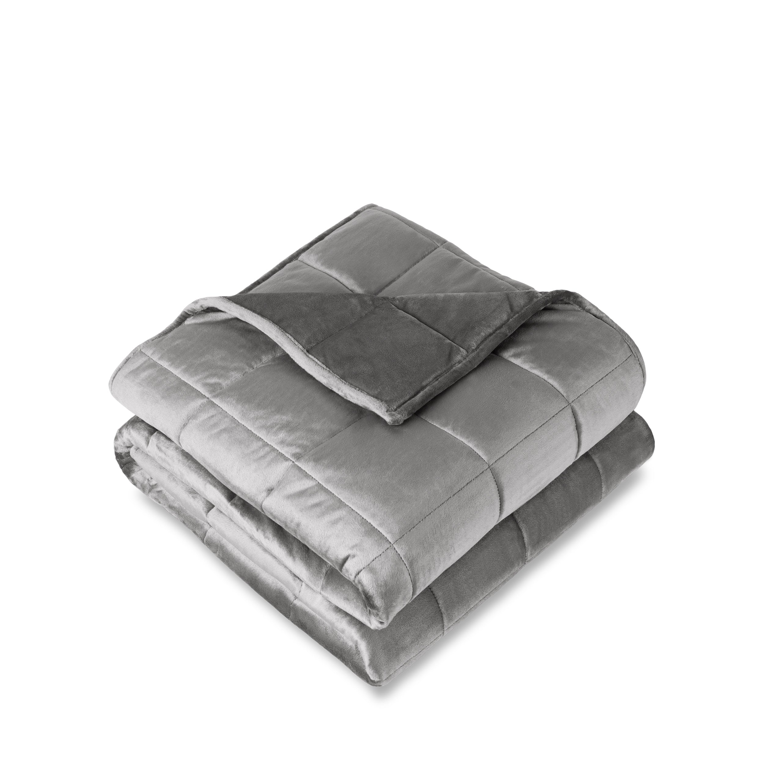 A minky weighted blanket folded neatly on a white background