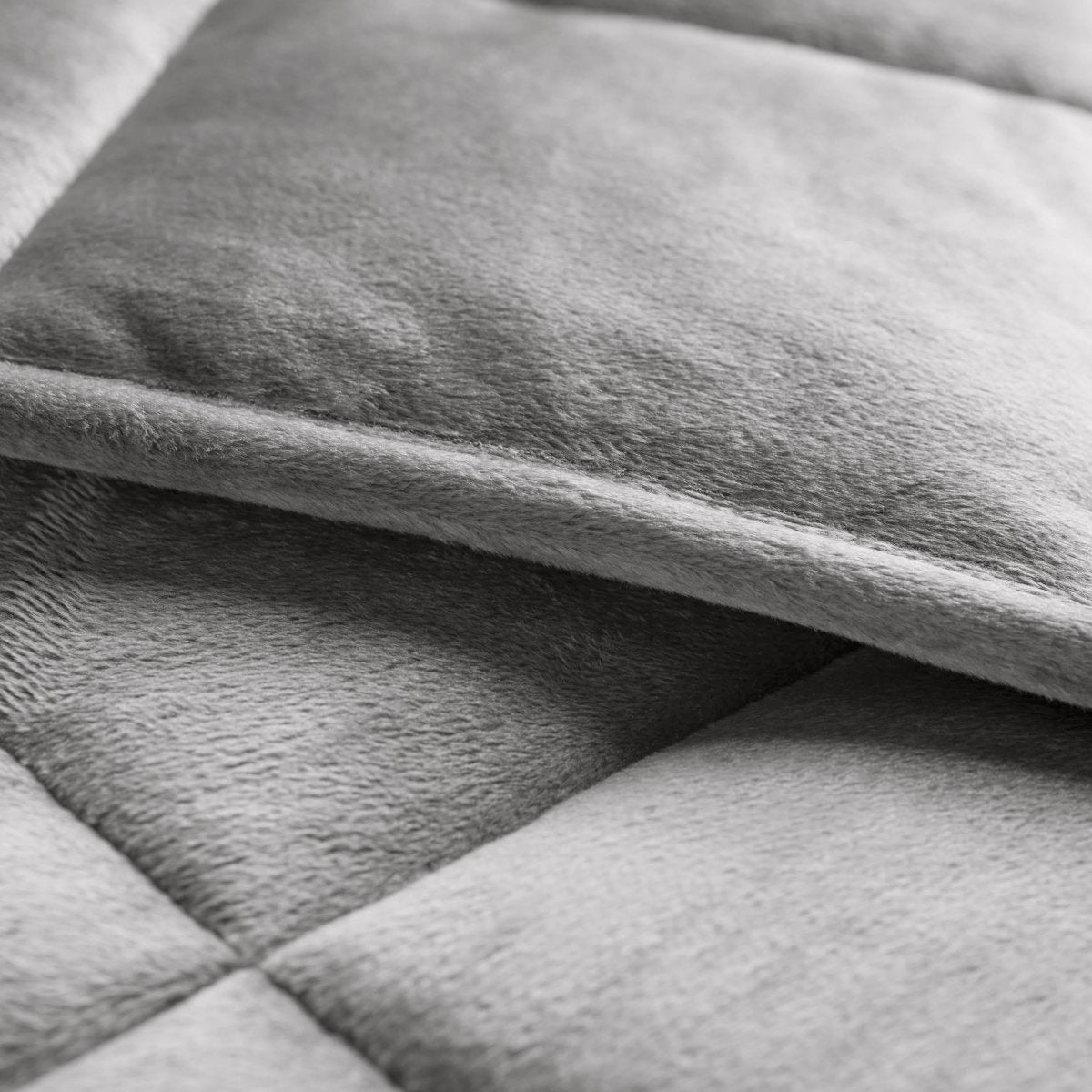 Close-up of a weighted blanket showing the stitching and texture