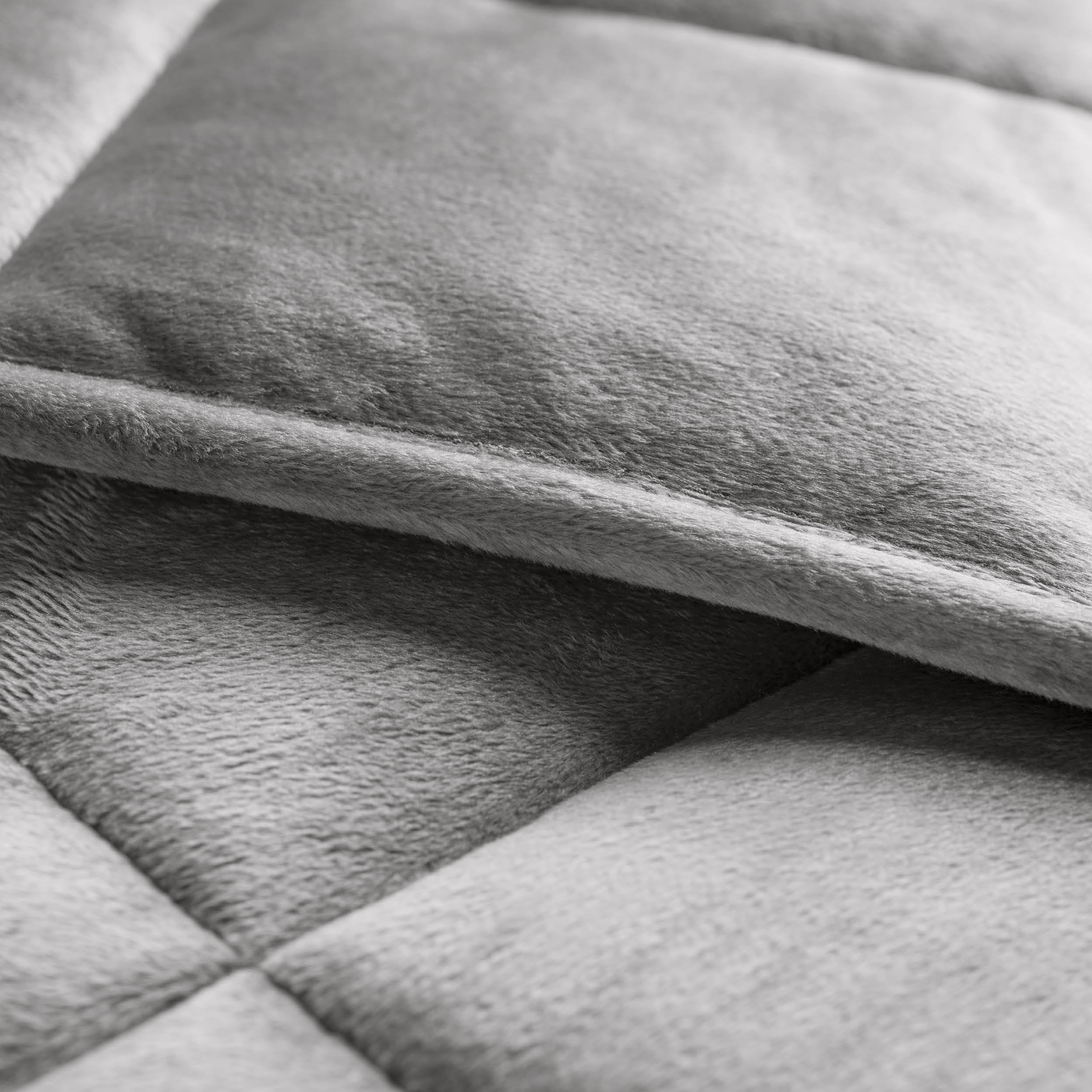 Close-up of a weighted blanket showing the stitching and texture