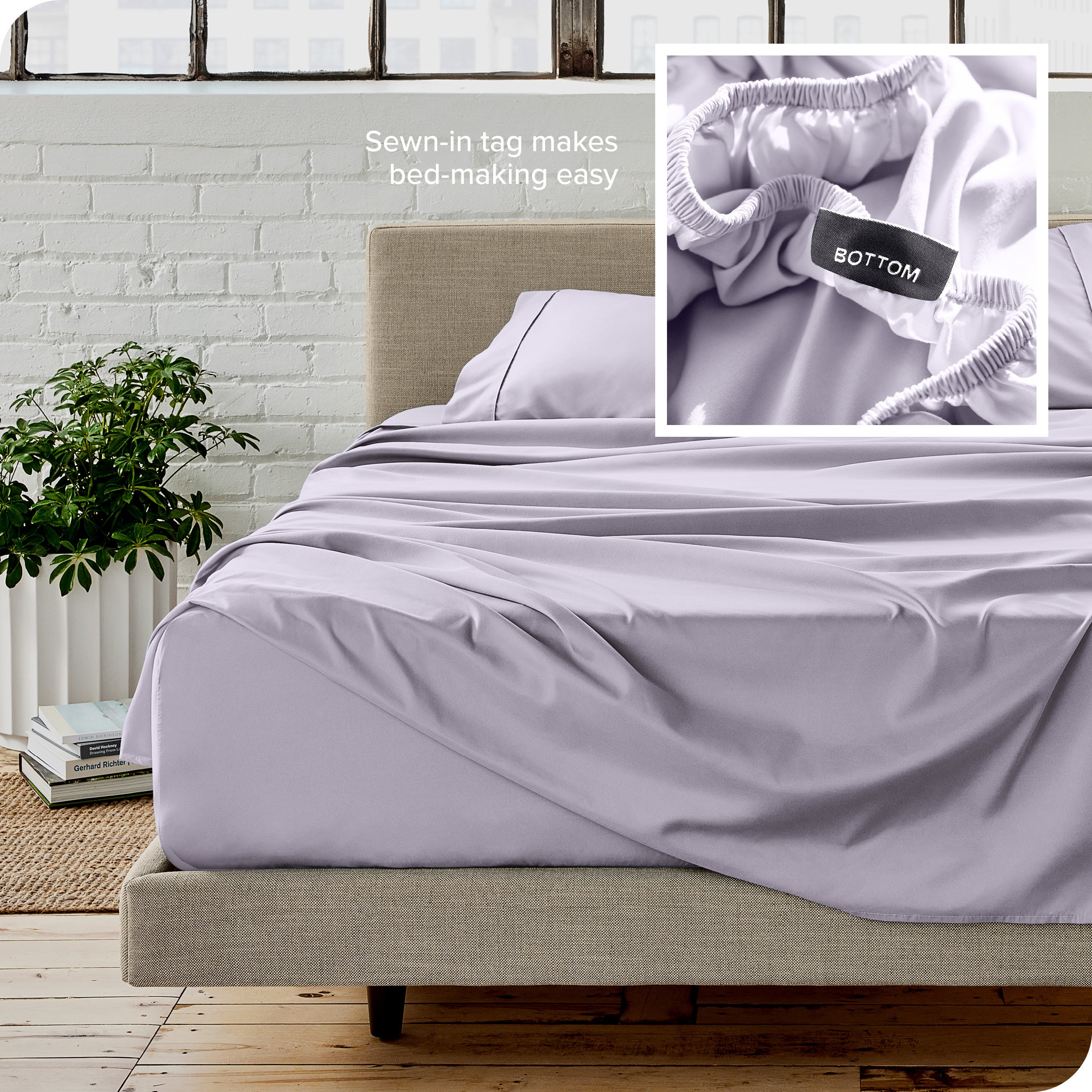 Close up of sewn in tag and matching sheets on a bed