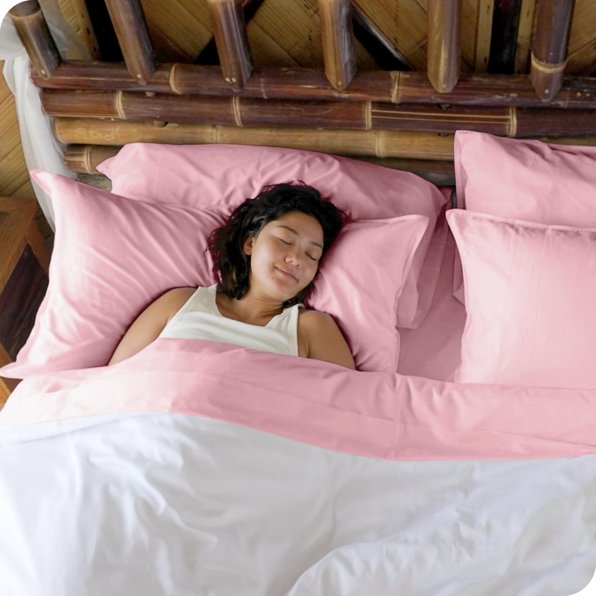 A woman sleeping in a bed made with bamboo sheets