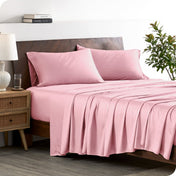 A stylish bed with bamboo sheets and pillowcases, showcasing a sophisticated and elegant bedroom setting.