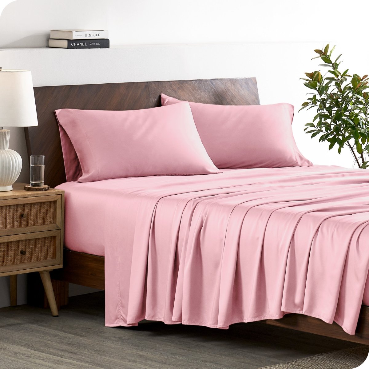 A stylish bed with bamboo sheets and pillowcases, showcasing a sophisticated and elegant bedroom setting.