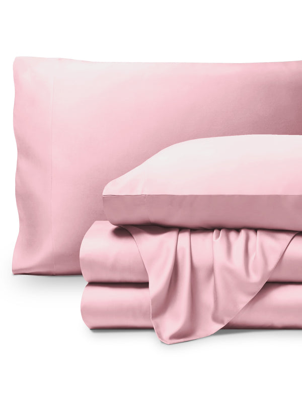 Bamboo pillowcases and sheets set on a white background