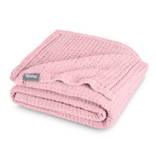 A cotton waffle blanket folded