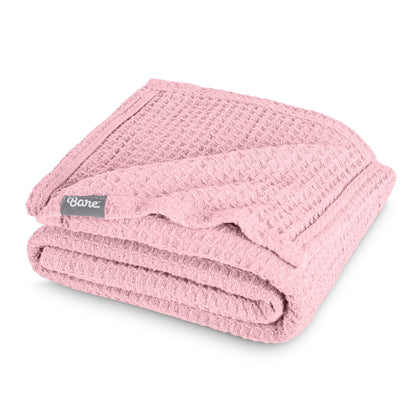 Folded blanket with a Bare Home label on a white background