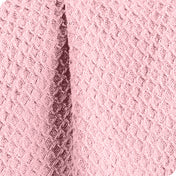 Close up of the fabric of a cotton waffle blanket