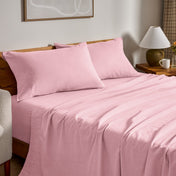 Flannel bed sheets and pillowcases on a bed in a bedroom setting.