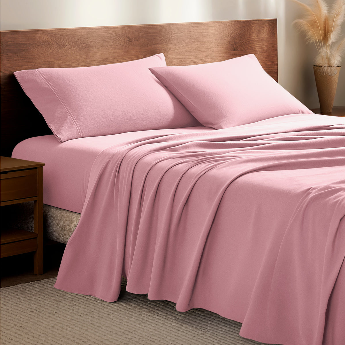 Flannel bedding set on a bed with a wooden headboard and side table