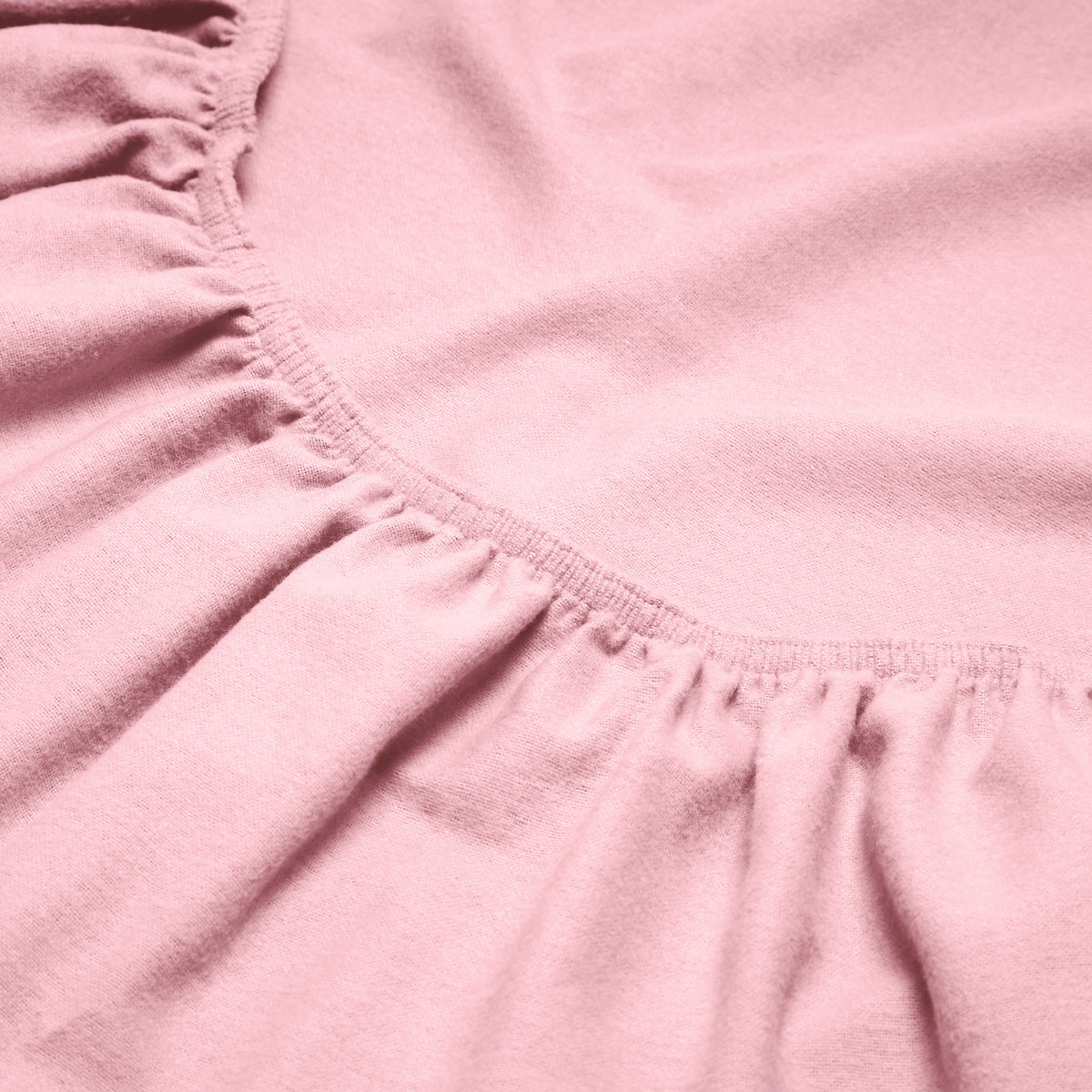 Close-up of a flannel fitted sheet with gathered elastic