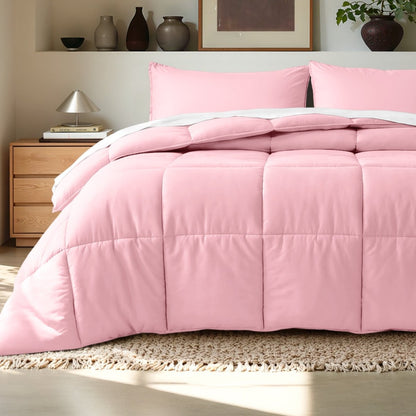 Comforter on a bed in a bedroom setting with a wooden nightstand and decorative items.