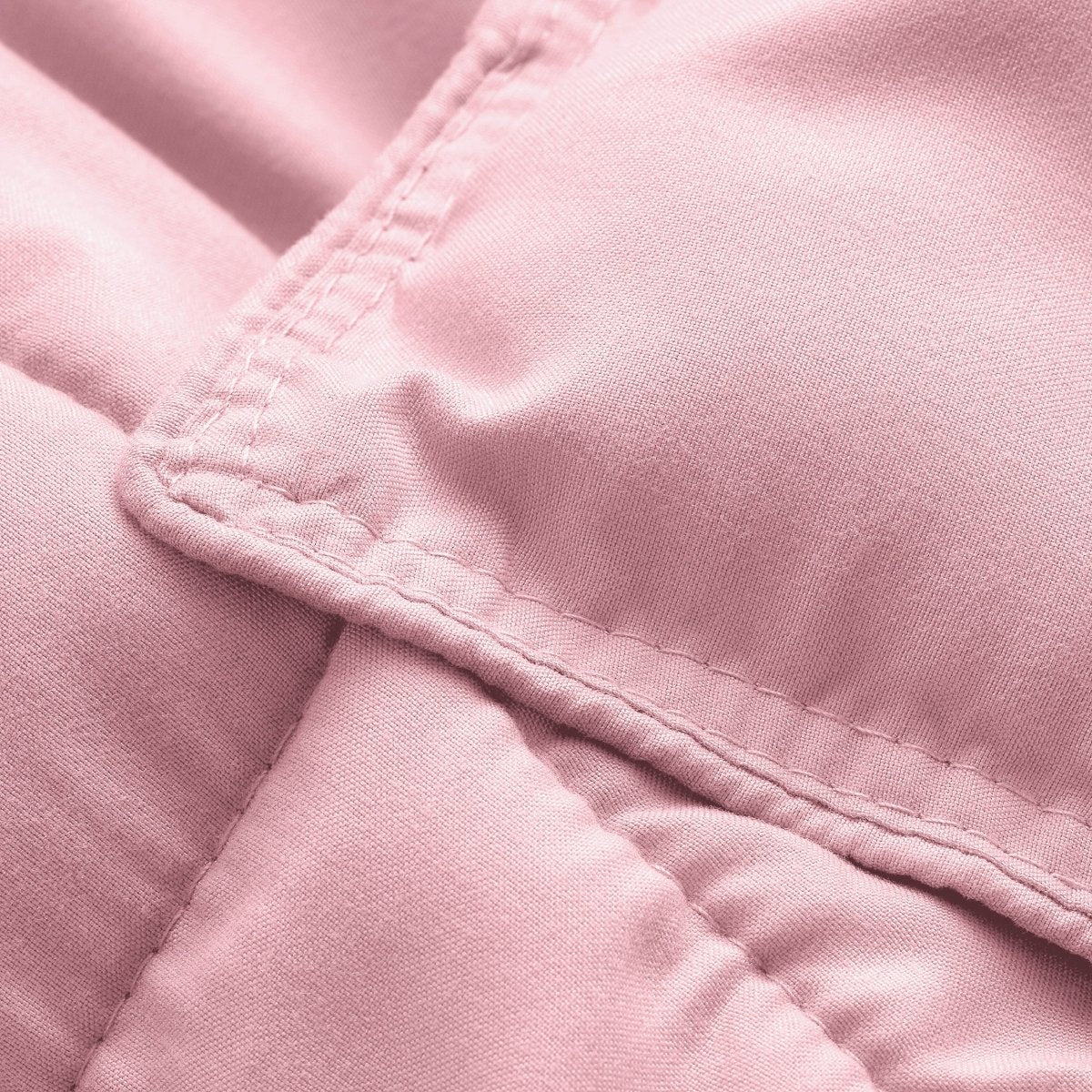 Close-up of comforter fabric with stitching detail