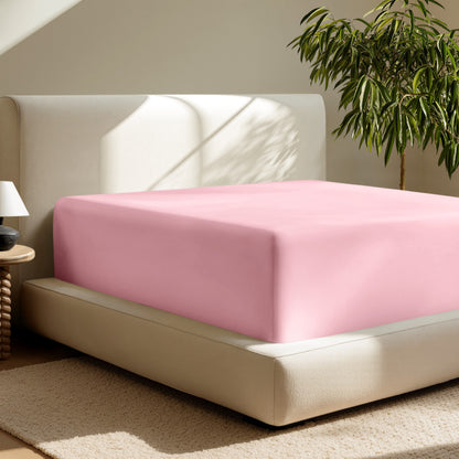 A deep pocket fitted sheet on a mattress