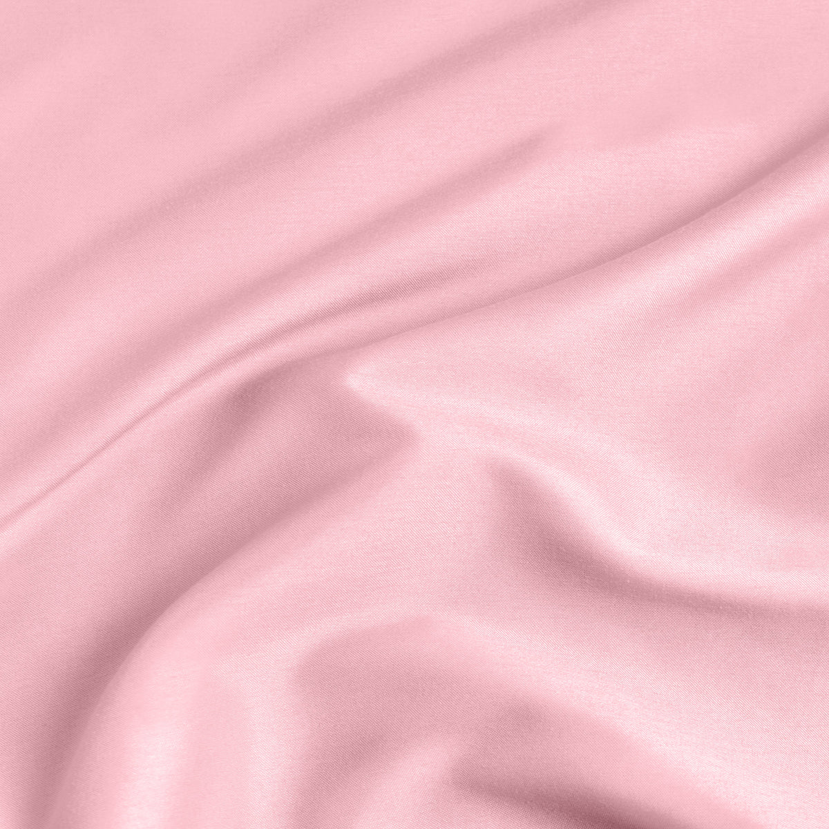 A close-up of a fitted sheet with a label printed with the word 'BOTTOM' in white.