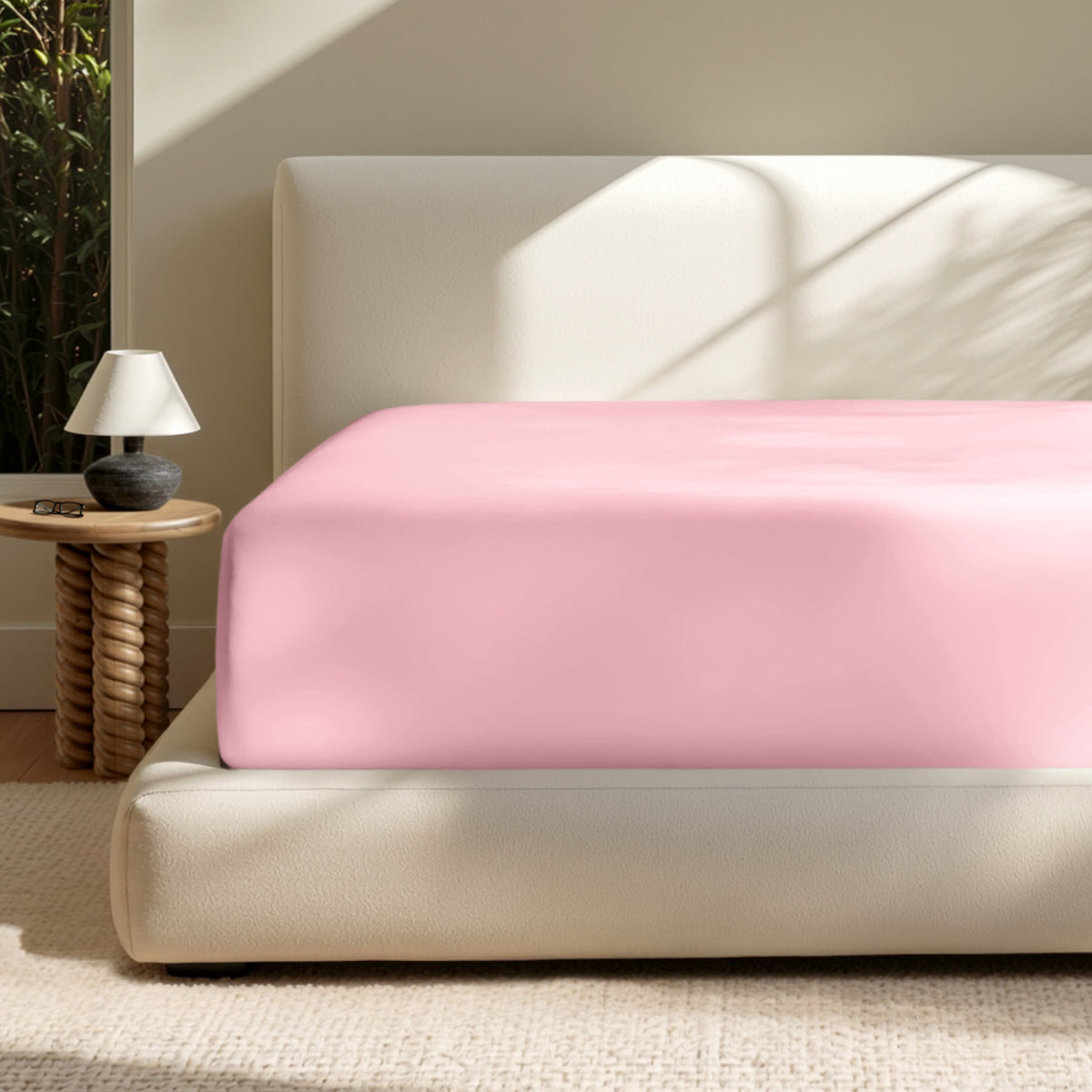 A deep pocket mattress with a fitted sheet on it
