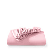 A fitted sheet folded neatly with the all around elastic showing