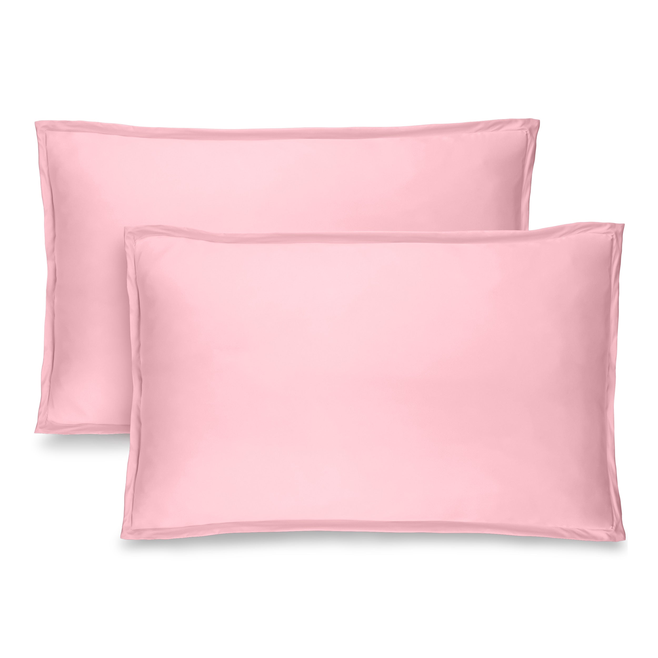 Two pink pillow shams on pillows standing up with one behind the other