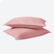 Man sleeping with his head resting on a pillow sham