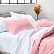 Close up of pillow shams on a bed
