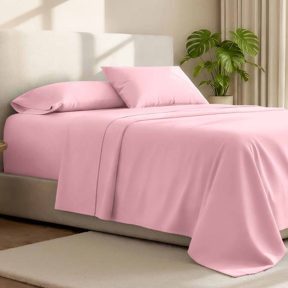 Microfiber bed sheets on a neatly made bed with a wooden headboard and nightstand.