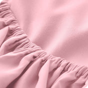 A close-up of a fitted sheet showcasing its elastic edge