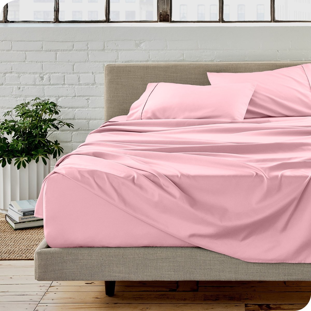 A modern bedroom with microfiber sheets on the mattress