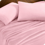 A sheet set and matching pillowcases on a bed.