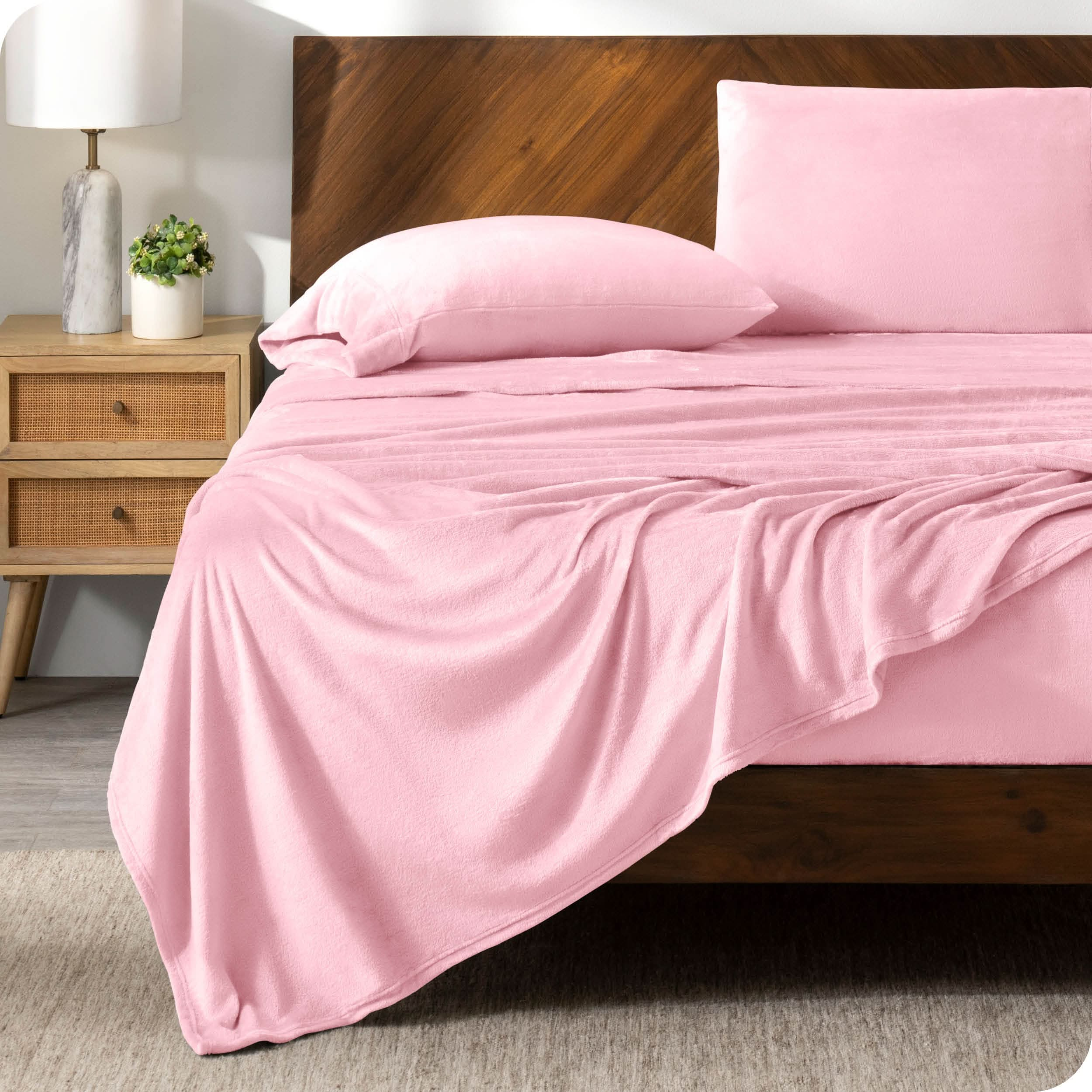 A microplush sheet set on a bed in a modern bedroom.