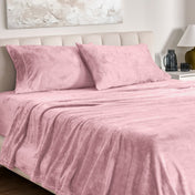 Microplush sheet set on a bed.