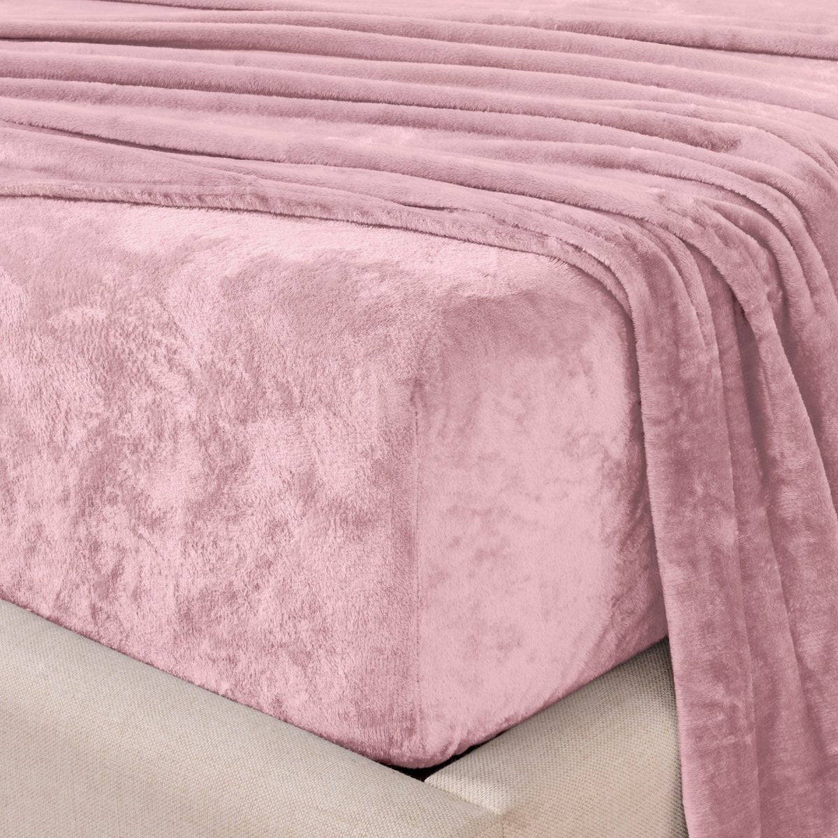 Close-up of the corner of a bed made with microplush sheets