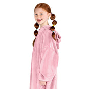 A girl has a microplush wearable blanket on