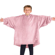 A boy wearing a blanket made of microplush, showcasing comfort and warmth.