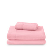Polar fleece sheets and pillowcases folded and stacked on a white background