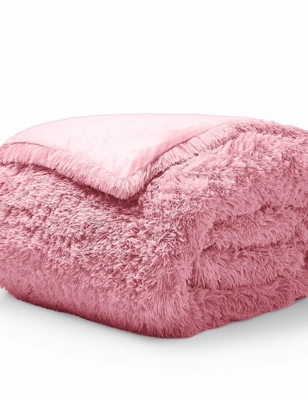 A pink shaggy duvet cover folded neatly