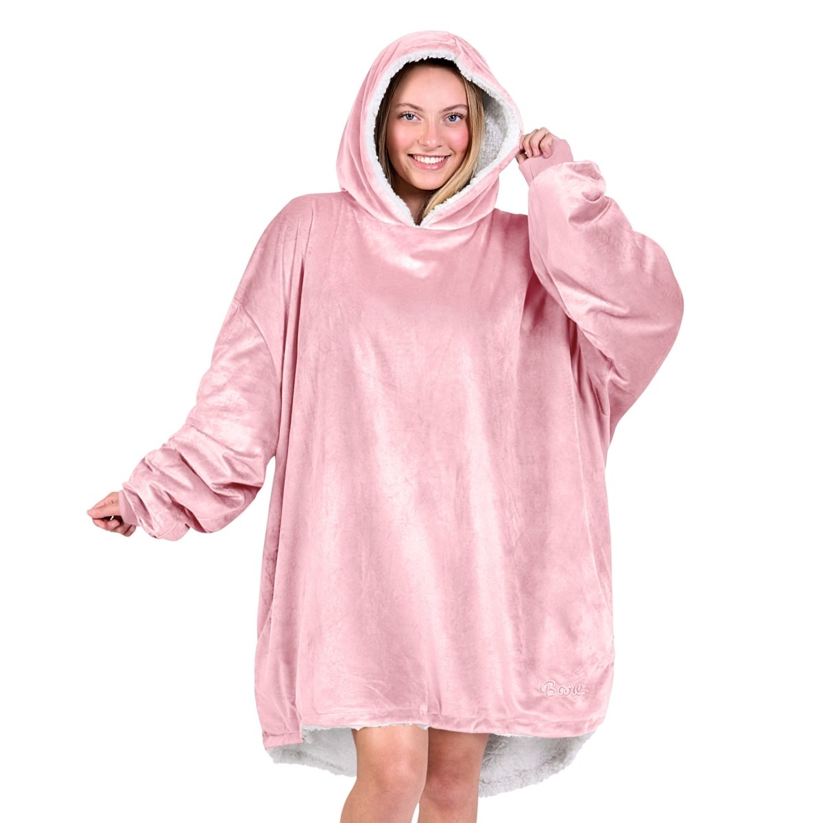 An adult with a sherpa wearable blanket on