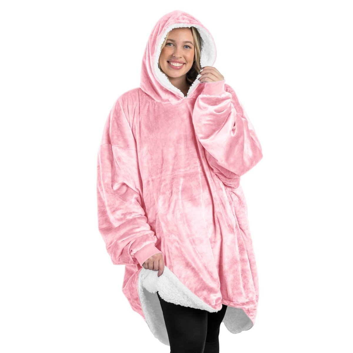 An adult with a sherpa wearable blanket on