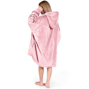 An adult with a hooded wearable blanket on