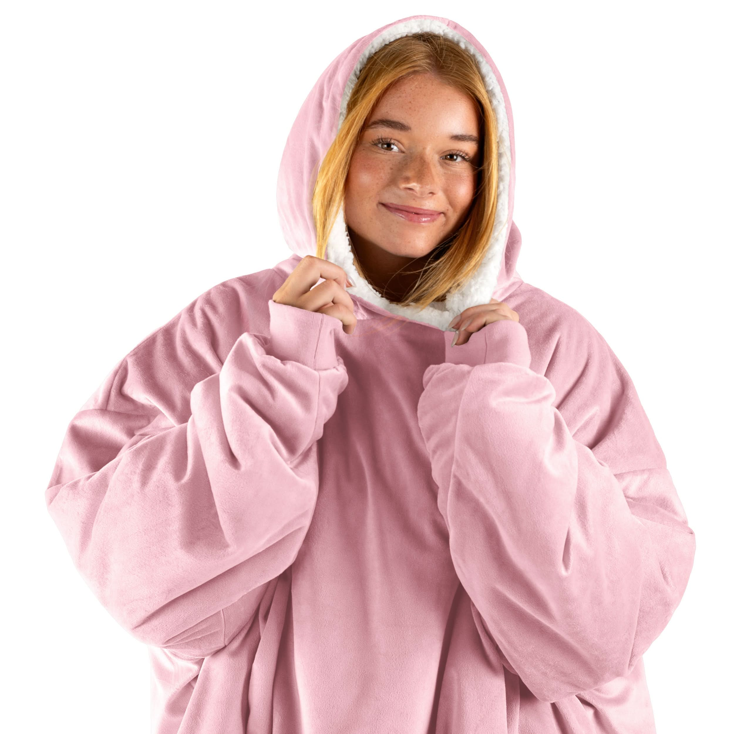 An adult with a wearable blanket on