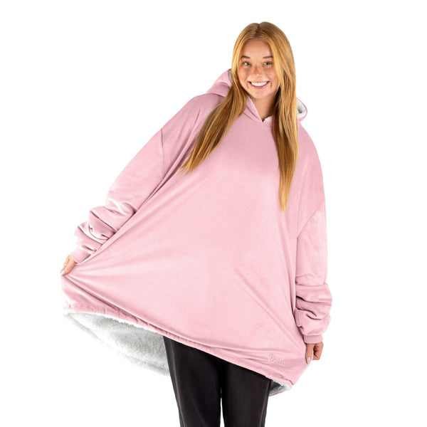 An adult with a sherpa wearable blanket on