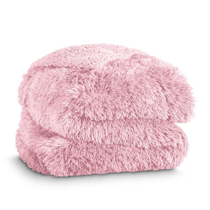 A shaggy faux fur blanket folded neatly