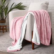 Blanket draped over a chair in a cozy living room setting.