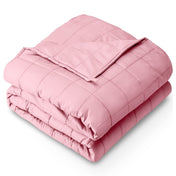 A folded cotton weighted blanket with a white background