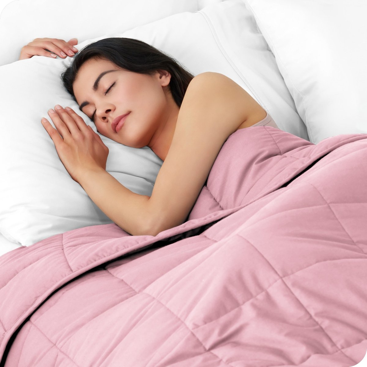 A woman sleeping with a weighted blanket over her body