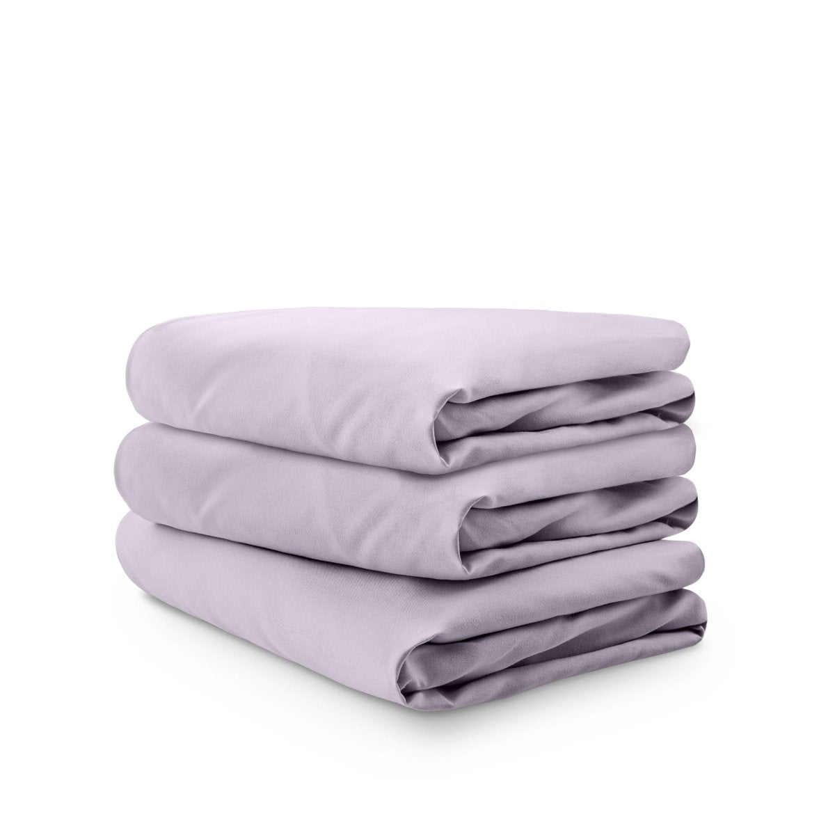 Stack of folded crib sheets on a white background