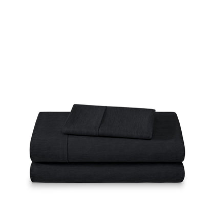 Set of bed sheets folded on a white background