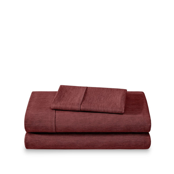 Set of bed sheets folded on a white background